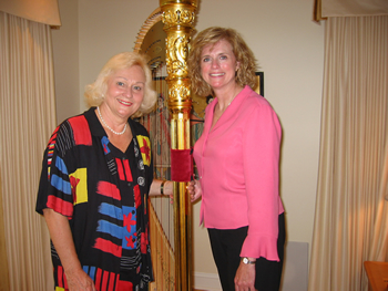 July 2004:  Peggy had the privilege of welcoming to the State of Indiana the participants of the sixth USA International Harp Competition.  Peggy is pictured with the world renowned harpist and founder of the competition Suanne MdDonald.